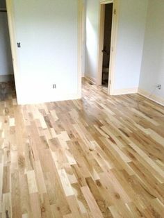 an empty room with hard wood flooring and white paint on the walls is shown