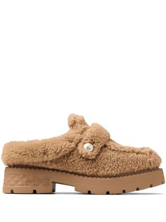 caramel brown sheepskin shearling slip-on style round toe branded footbed ridged rubber sole Jimmy Choo Mules, Moccasins Style, Bridesmaid Bags, Winona Ryder, Loafer Mules, Leather Bucket Bag, Jimmy Choo Shoes, Boot Bag, Mule Flat