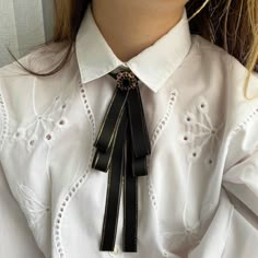 Thin black bow tie for women. Cowboy handmade ties. Gift for her. Color :  black. Length: 8.5 Inches Width: 3.0 Inches DISCLAIMER: Some items may contain small parts that may pose a choking hazard for small children should they come loose. Please supervise children at all times while wearing any item purchased from NataliBrooches. The buyer assumes all responsibility at the time of purchase. If you have any questions, do not hesitate to contact me and I will get back to you right away. If you have special requests, leave it in your comment.  Do you want to look through more bow ties in such design? You could find them here:  https://www.etsy.com/shop/NataliBrooches?ref=seller-platform-mcnav&section_id=23852811 Follow us on Instagram for sneak peaks and exclusives on new releases  https://w Female Bow Tie, Suits For Women With Tie, Queer Black Tie Fashion, Women’s Tie, Bowtie Outfits For Women, Women Tie Outfit, Tie On Women, Bow Tie Outfits For Women, Bow Tie Aesthetic