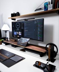 a desk with a computer monitor, keyboard and mouse