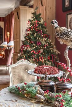 a christmas tree is in the background behind a table with food and decorations on it