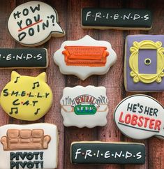 decorated cookies with funny sayings on them sitting on top of a wooden table next to each other