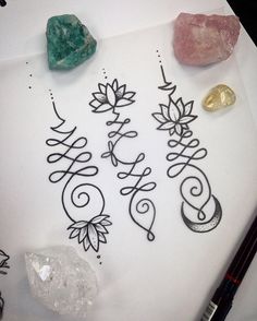 an image of some type of art work on the table with rocks and crystals around it