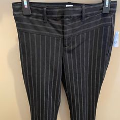 Really Cute New Black Pinstriped Ankle Pants Approx 27 In From Inseam. They Have Some Stretch. Very Comfortable. 2 Closed Design Only Pockets I’m Back. Front Closure Zipper Two Hooks And A Button. Very Good Quality. Look Really Nice On For Work Or Casual Don’t Fit. Never Worn. Has Tags On Them. Fitted Pinstripe Ankle-length Pants, Fitted Gap Bottoms For Business Casual, Striped Fitted Bottoms With Tapered Leg, Pinstripe Fitted Ankle-length Bottoms, Fitted Pinstripe Ankle-length Bottoms, Gap Black Workwear Pants, Black Gap Pants For Work, Fitted Ankle-length Pants With Vertical Stripes, Fitted Vertical Stripes Ankle-length Bottoms