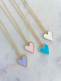 Beautiful heart necklace on 14k gold filled chain with 14k gold filled jumprings & clasp. Giftbox included. Choose color in drop down. Charm is approximately 8x10mm and is 14k gold plated. Such a great layering piece to add a touch of color! Heart Shaped Minimalist Charm Necklace For Best Friend, Minimalist Heart Charm Necklace For Best Friend, Dainty White Necklace For Best Friend Gift, Dainty Heart Pendant Charm Necklace For Best Friend, Minimalist 14k Gold Filled Necklaces With Heart Charm, Dainty Heart Pendant Necklace For Best Friend, Minimalist 14k Gold Filled Necklace With Heart Charm, Minimalist 14k Gold-filled Necklace With Heart Charm, Dainty Heart Charm Necklace For Best Friend Gift