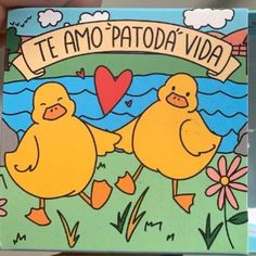 there are two yellow ducks that are on the book's cover, and one is holding it in its hand