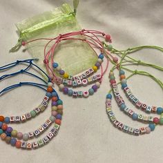 Going To The Eras Tour? Need Bracelets To Trade? Want Unique New Adjustable Taylor- Themed Friendship Bracelets? These Are For You! Set Of 9, Beaded Adjustable Bracelets With Mesh Drawstring Storage Bag, Nwt. Bracelets Are Handmade Using Neon Green, Pink & Blue Waxed Cotton Cord, Acrylic Square Multi Colored Letter Beads & Round 4mm Acrylic Beads. Bracelets Have Double Sliding Knots To Adjust The Size, Fits Wrist Size 6”-11”, Adjust To Fit Easily Over Your Hand, Perfect For Stacking & Trading. T Casual Pink Name Bracelet For Birthday, Casual Pink Name Bracelet For Gift, Casual Pink Name Bracelet Gift, Personalized Pink Friendship Bracelets For Party Favors, Adjustable Pink Beaded Bracelets For Party Favors, Casual Customized Pink Name Bracelet, Pink Letter Beads Bracelets For Party Favors, Customized Cute Pink Friendship Bracelets, Pink Casual Name Bracelet For Friendship