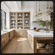 a kitchen filled with lots of wooden cabinets and counter top space next to a window