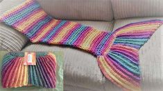 a knitted mermaid tail sitting on top of a couch next to a pillow with a tag