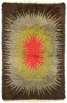 a square rug with an orange and yellow design on it's center, surrounded by fringes