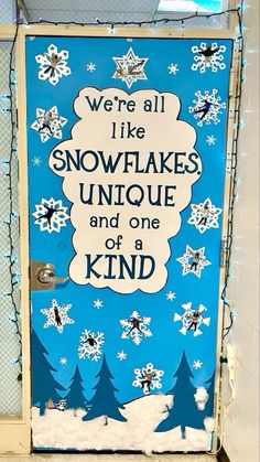 a door decorated with snowflakes and saying we're all like snowflakes unique and one of a kind