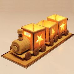 a wooden toy train with stars on it