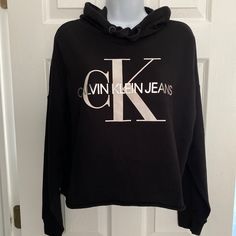 New For The Season** Signature Calvin Klein Black Cropped Raw Hem Sweatshirt Hoodie-Super Soft Cotton! Very Popular! Shoulder To Bottom Hem Is Approx 20” Nwt! What A Fun Casual Sweatshirt! Cheap Collared Tops By Calvin Klein, Casual Hoodie Tops With Logo Print, Fall Hooded Top With Logo Print, Calvin Klein Cotton Loungewear Tops, Calvin Klein Cotton Tops For Loungewear, Black Logo Print Sweatshirt For Loungewear, Trendy Calvin Klein Tops For Fall, Trendy Calvin Klein Fall Tops, Spring Logo Print Hoodie