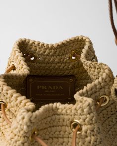 Natural Crochet And Leather Mini-bucket Bag | PRADA Designer Crochet Tote Bag For Travel, Designer Straw Bucket Bag With Braided Handles, Designer Woven Leather Bucket Straw Bag, Designer Woven Leather Straw Bucket Bag, Designer Woven Straw Bag For Travel, Designer Beige Crochet Bag For Travel, Designer Beige Crochet Tote Bag, Luxury Woven Leather Straw Bucket Bag, Luxury Straw Bucket Bag With Woven Leather