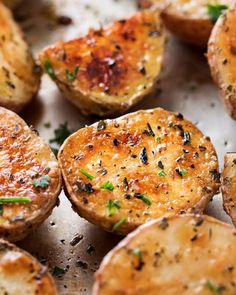 baked potatoes with herbs and seasoning on top