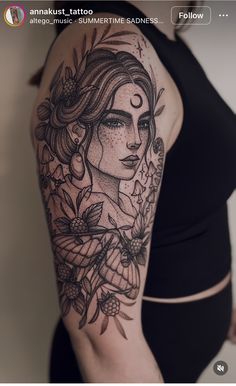 a woman's arm with tattoos on it and flowers around her neck, in black and white