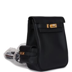 This Hermes Mini Kelly Jump Backpack is in Black swift leather with gold hardware, featuring tonal stitching, a mini exterior pouch on side of backpack, pull straps that attach to a toggle closure, and has adjustable flat leather backpack straps.The interior is lined in Black swift leather and has one slip pocket on rear wall.Collection: WOrigin: FranceCondition: New and never worn (plastic on hardware and straps) Accompanied by: Hermes box, Hermes dustbag, carebook, ribbon and feltMeasurements: New Swift, Mini Kelly, Hermes Birkin 25, Hermes Box, Birkin 25, Backpack Straps, Hermes Birkin, Black Backpack, Leather Backpack