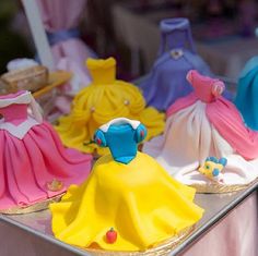 there are many princess cakes on the table