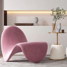 two white and pink chairs sitting next to each other in front of a table with vases on it