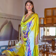 A handpainted unique greek design in yellow colors showcasing the Victory of Samothrace in a silk scarf that is made from pure silk in Soufli, Greece by Kalfas. Can be worn as a lightweight dress tied around your body however is most comfortable and easy to style for you. SIZE 140 centimetres by 140 centimetres WEIGHT 131gr FABRIC Each scarf is made with pure silk crepe satin, with 16 mm thickness COLOR Colours may appear different in the photo because of camera angles or shadows. Primary color: Summer Scarf Tying, Yellow Silk Scarf For Summer, Yellow Bohemian Silk Scarf For Summer, Gold Silk Bohemian Scarf, Yellow Artistic Silk Scarf For Spring, Yellow Bohemian Silk Shawl Scarf, Luxury Yellow Silk Scarf, Dress Scarf, Camera Angles