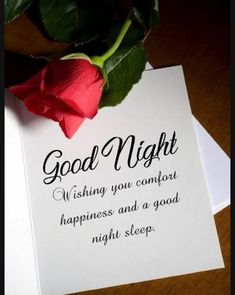 a rose sitting on top of a piece of paper next to a card that says, good night wishing you comfort happiness and a good night sleep