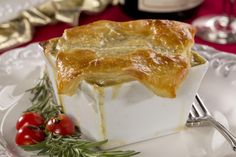 a piece of pie sitting on top of a white plate