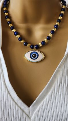 Large Handmade Ceramic Evil Eye Necklace and Bracelet set , Natural Stone jewelry set , Lapis Lazuli ceramic evil eye necklace and bracelet Necklace :17 inch long with 3 inch chain total can be 20 inch  Bracelet : Stretch Cord Adjustable Spiritual Beaded Necklace With Evil Eye, Adjustable Spiritual Evil Eye Beaded Necklaces, Adjustable Evil Eye Choker, Adjustable Evil Eye Spiritual Necklace, Ceramic Evil Eye, Spiritual Evil Eye Metal Necklace, Necklace And Bracelet Set, Natural Stone Jewelry, Necklace And Bracelet