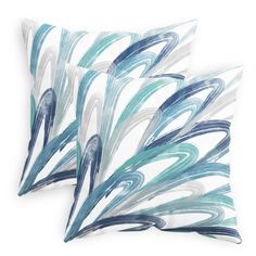 two pillows with blue and white designs on them