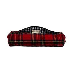 a red and black plaid bag on a white background