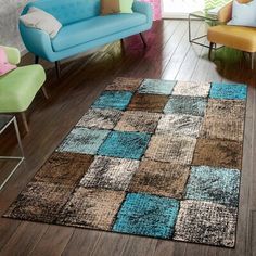 a living room filled with furniture and a colorful rug