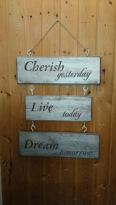 three wooden signs hanging on the side of a door that says cherish, give today, live today, dream tomorrow