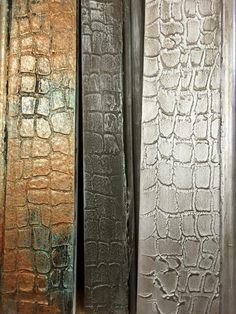 four different color and textured metal panels