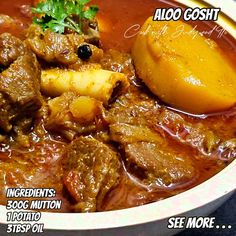 a bowl filled with meat and potatoes on top of a table