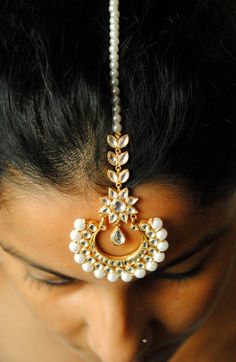 "A gorgeous cresent shaped centre piece, with kundan set stones adorned with imitation pearls. This handcrafted head gear is a must have style statement! * Stone : CZ (can me made in natural uncut flat diamonds as well. Please convo for quote) * Gold - 18k, 11 gms yellow gold * Centre piece : 2\" x 3.5\" approx * Total Length : 7.5 inches (including centre piece and hook) If you like this piece, please press \"Pin it\" button on the right of your screen. Find us on Instagram for exquisite design Kundan Maang Tikka, Maang Tikka Kundan, Forehead Jewelry, Pin It Button, Diamond Ear Cuff, Kundan Jewelry, Kundan Set, Oval Diamond Engagement, Diamond Tiara