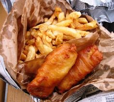 there are french fries and fish in the paper bag