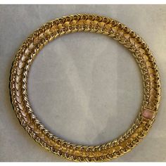 This is part of Chairish’s Costume Jewelry assortment.  A magnificent and weighty gold-tone and white enameled Ciner choker/collar, ca. late 1950s/early 1960s.  This choker belonged to a notable costume jewelry industry professional, who worked for Trifari.  Ciner jewelry was founded in New York City in 1892 as a fine jeweler and this family-owned operation is still in business today!  Since 1931, the company has produced fine costume jewelry. Luxury Gold Evening Choker, Luxury Gold Choker For Evening, Vintage Gold Round Choker, Gold Costume Jewelry Choker For Evening, Luxury Gold Choker With 17 Jewels, Gold Round Costume Jewelry Choker, Gold Costume Jewelry Choker, Gold Choker With 17 Jewels, Ciner Jewelry