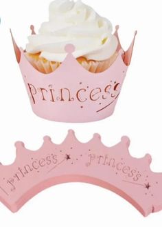 a pink princess cupcake with white frosting on it's top and the words princess written in cursive writing