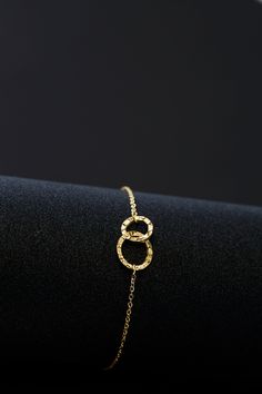 This Delicate Double Circle Hammered Gold Bracelet is an exquisite accessory, crafted with the utmost precision for a luxurious feel. The glossy, gold-plated stainless steel accents will bring a beautiful touch of sophistication to any ensemble. With its 15 cm length, it is delicately dainty, and will subtly complement your look. Elegant Yellow Gold Stainless Steel Bracelets, Elegant Yellow Gold Stainless Steel Bracelet, Elegant Adjustable Circular Chain Bracelet, Elegant Gold Stainless Steel Bracelet For Formal Occasions, Dainty Gold Metal Bracelet For Formal Occasions, Elegant Gold Plated Circle Jewelry, Elegant Circular Gold-tone Jewelry, Elegant Stainless Steel Chain Bracelet For Party, Circle Bracelet