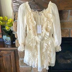 Anthropologie Dress. Beautiful Ivory Cream Color Ruffle Mini Dress. Off Shoulder Style. Smocked Stretch Waist. Semi Sheer Sleeves. Lined Everywhere Else. Pretty! Pit To Pit 20”, Length 32” Chic Cream Ruffle Dress For Spring, Summer Cream Ruffle Dress, Off White Long Sleeve Mini Dress With Ruffles, Cream Mini Dress With Ruffles For Spring, Beige Ruffled Mini Dress For Garden Party, Mini Dress Off Shoulder, Ruffled Mini Dress, Dress Off Shoulder, Off Shoulder Fashion