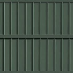 the side of a building with green siding