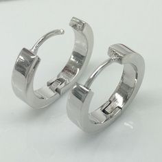 18 gauge sterling silver hoop earrings for men. Handmade from solid high quality 925 sterling silver and plated in yellow gold. Sold as a pair or single earring. Specification Base metal: 925 sterling silver Outer plating: white gold, polished Outer diameter: 17mm Inner diameter: 13mm, size L Width: 3.5mm Measurements are an approximation Ear post gauge: 18G Link to customize ear post gauge https://www.etsy.com/listing/245008458 More gauged earrings https://www.etsy.com/shop/360JewelsElite?ref=h Handmade Silver Small Hoop Plug Earrings, Silver Hoop Plug Earrings, Mens Earrings Hoop Silver, Nickel-free Hoop Metal Plug Earrings, Nickel-free Small Hoop Silver Plug Earrings, Hoop Earrings For Men, Gauge Earrings, Mens Earrings Hoop, Earrings For Men