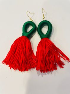 These two-toned loop tassel earrings can easily add a pop of color or elevate a casual outfit. All earring are made with 18k gold coated hooks. Trendy Handmade Festive Earrings, Trendy Handmade Earrings For Festive Occasions, Red Bohemian Earrings For Christmas, Handmade Trendy Red Tassel Earrings, Gift Red Hoop Earrings With Latkans, Red Hoop Earrings With Latkans For Gift, Handmade Green Tassel Earrings For Party, Red Hoop Earrings With Latkans As A Gift, Handmade Festive Tassel Earrings