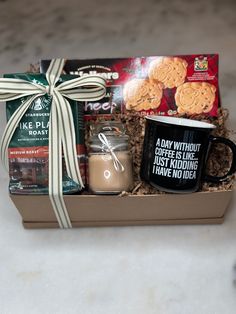 a coffee mug and cookies in a gift box