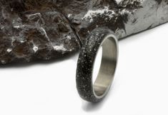 TAGS: stardust ring, gift for him, meteorite inlay ring, muonionalusta meteor, His Her Promise Ring, gibeon meteorite, Meteorite Ring Band, space rock ring, Meteorite wedding ri, mens wedding band, meteorite jewelry, Husband Gifts, Space jewel RING SPECIFICATION: METAL: High-grade Titanium (5 and 6 grade) FITTING: Standard INLAY: Gibeon Meteorite SHANK:  dome, half round SIZE: 5 to 16 US WIDTH : 3 to 12 mm The ring pictured measures 6 mm in width We do all sizes for men and women US/Canada scale Stardust Ring, Meteorite Wedding Ring, Meteorite Wedding Rings, Rock Ring, Space Dust, Gibeon Meteorite, Damascus Ring, Meteorite Jewelry, Rock Rings