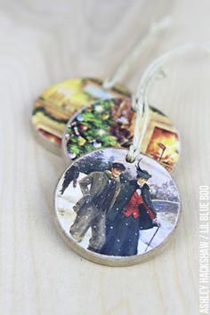 three christmas ornament with two people walking in the snow