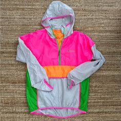 New Without Tags - Such A Chic Fun And Bright Camping Layer! Women’s Xl Men’s Large Product Details Highly Packable And Weather-Resistant, The Teca Half-Zip Windbreaker Is Made From Panels Of Repurposed Polyester Taffeta, And Features An Interior Chest Pocket That Doubles As A Storage Pouch. The Teca’s Dwr-Finished Fabric And Packable Design Make It Great For Hiking, Camping, And Throwing In Your Travel Bag As That Ultralight, Just-In-Case Layer. Its Form-Fitting Scuba Hood And Front Zip Help Yo Pink Sporty Windbreaker For Outdoor Activities, Sporty Pink Windbreaker For Outdoor Activities, Pink Nylon Hiking Outerwear, Pink Nylon Outerwear For Hiking, Pink Nylon Athleisure Windbreaker, Pink Athleisure Windbreaker For Outdoor Activities, Pink Windbreaker For Outdoor Activities With Pockets, Pink Nylon Windbreaker For Outdoor Activities, Pink Nylon Casual Windbreaker