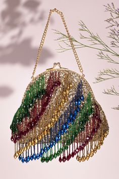 Festive Tasseled Potli Bag For Reception, Festive Potli Bag With Tassels For Reception, Festive Reception Potli Bag With Tassels, Traditional Tassel Potli Bag For Reception, Elegant Potli Bag With Tassels For Reception, Traditional Bags With Tassels For Reception, Traditional Tassel Bags For Reception, Multicolor Tassel Pouch Bag, Festive Gold Potli Bag With Tassels