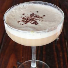 a close up of a drink in a glass on a table