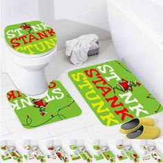 two bathroom mats with the words stank stuff on them next to each other in front of a toilet