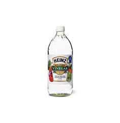 a bottle of heinz's vinegar vinegar with fresh vegetables on the inside and in the outside